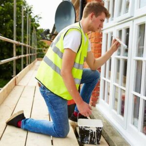 Man Painting Window | Building Material Reviews