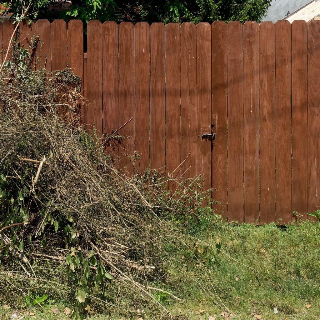 Garden Waste in Front of Fence | Building Material Reviews